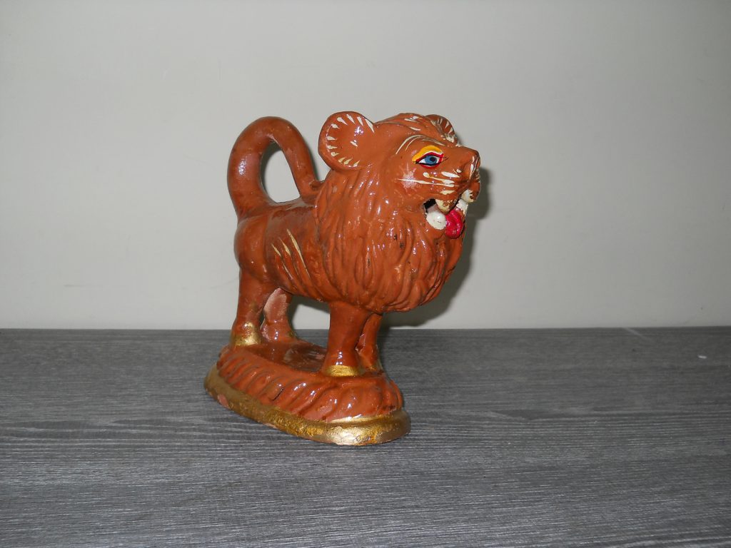 Staffordshire lion figurine. Rs. 500