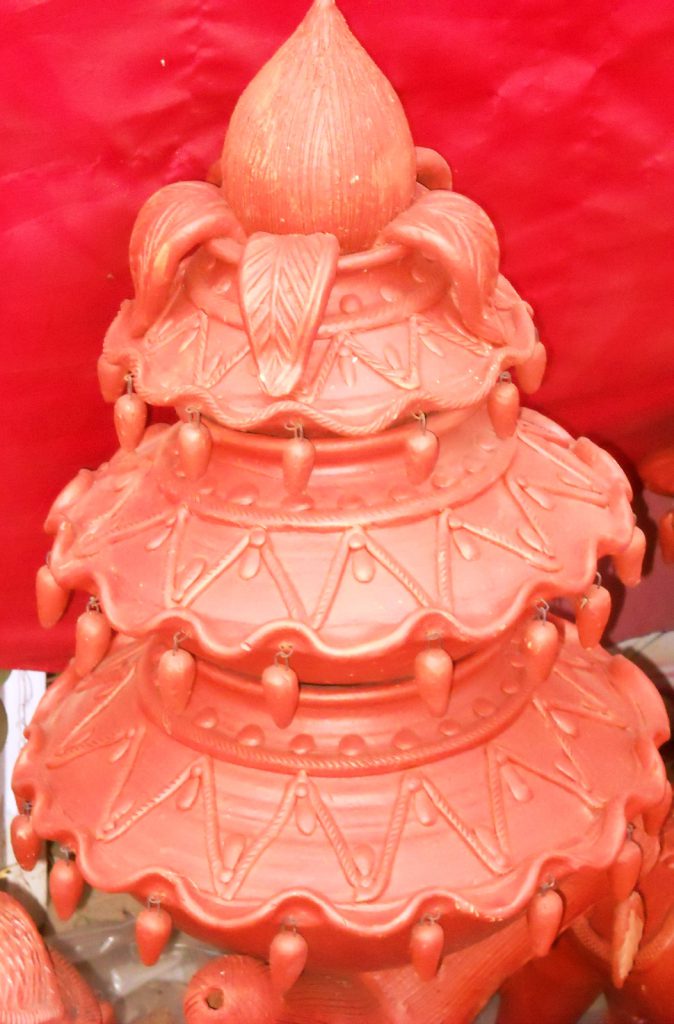 handcrafted terracotta multi-tiered diya stand. Rs. 800