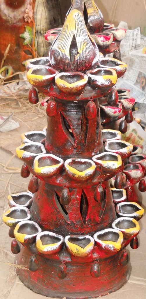 handcrafted terracotta multi-tiered diya stand. Rs. 800
