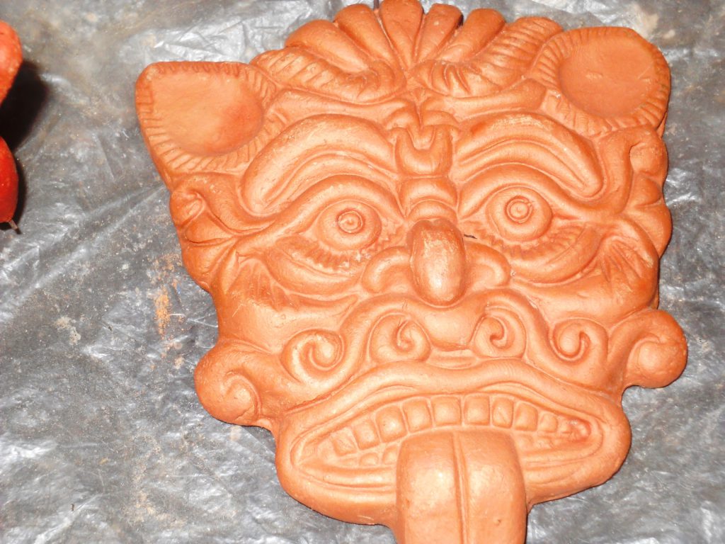 terracotta "Nazar Battu" mask. Rs. 500